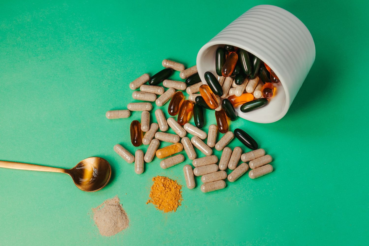 probiotic supplements on green background
